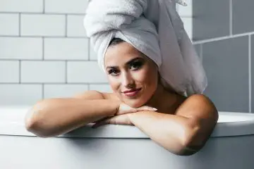women with hair towel on her head. women smiling