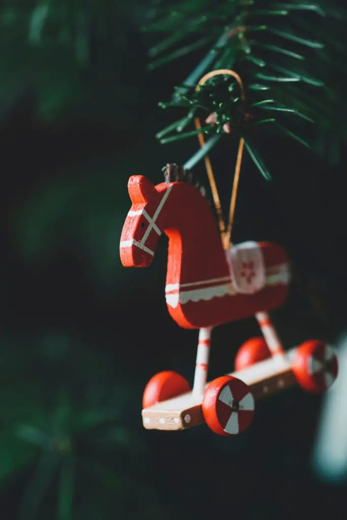 wooden horse Christmas decoration hanging on a Christmas tree