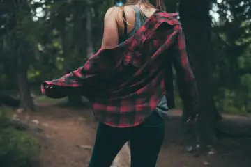 woman wearing flannel shirt with black jeans