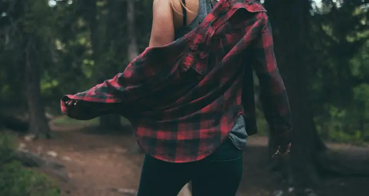 woman wearing flannel shirt with black jeans