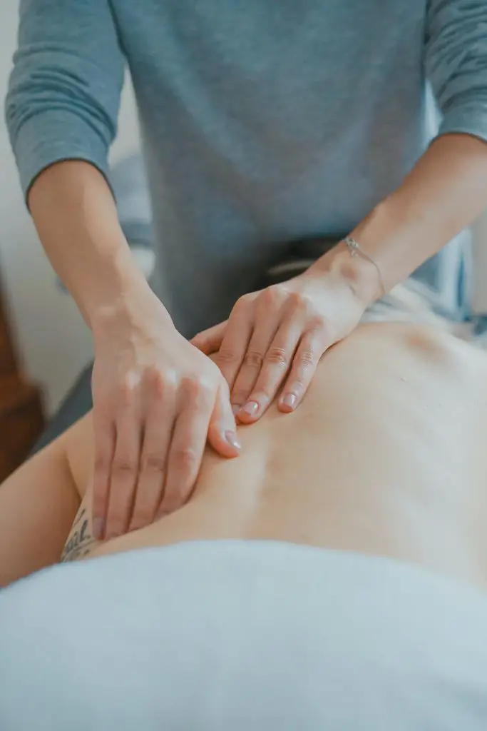 woman receiving back massage 