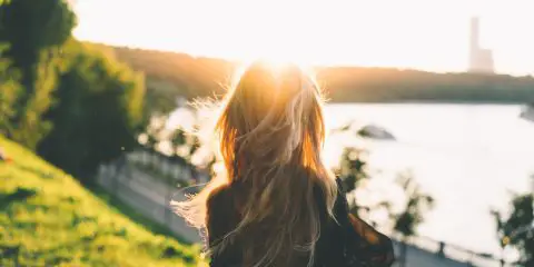 woman looking at the sunset